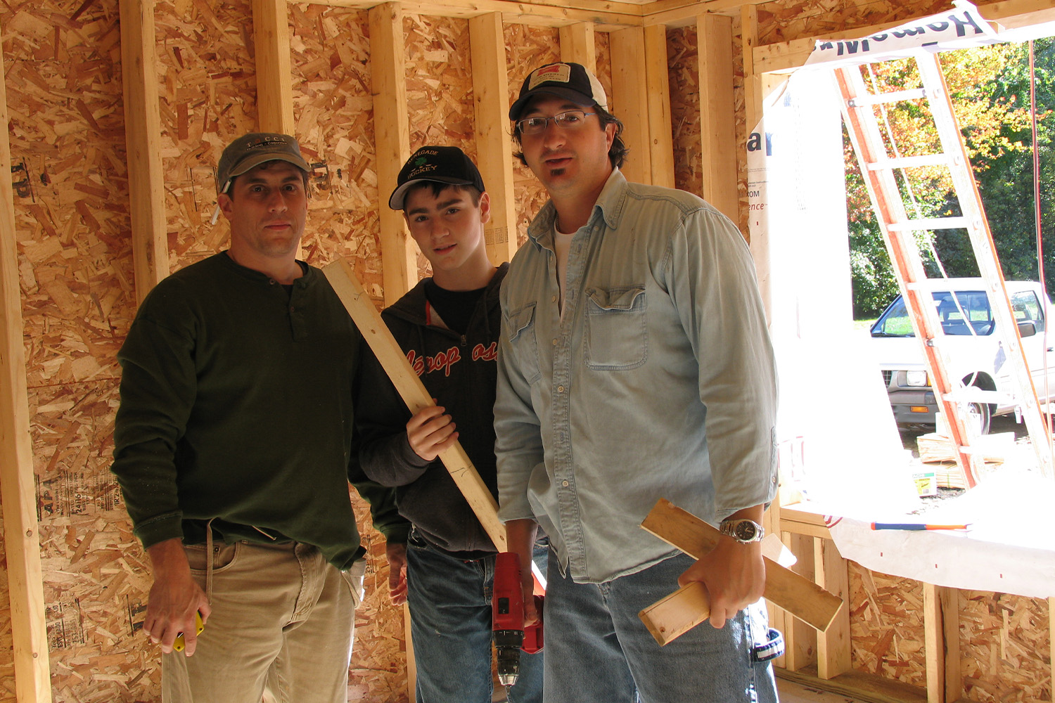 3 Tocci volunteers pose for photo 