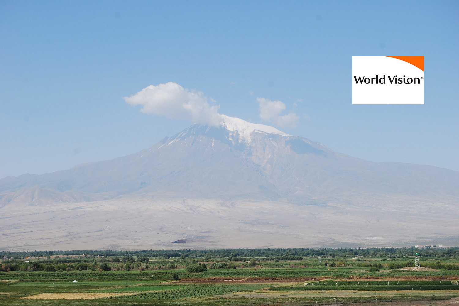 An Armenian village with view of the Caucasus mountains in the background