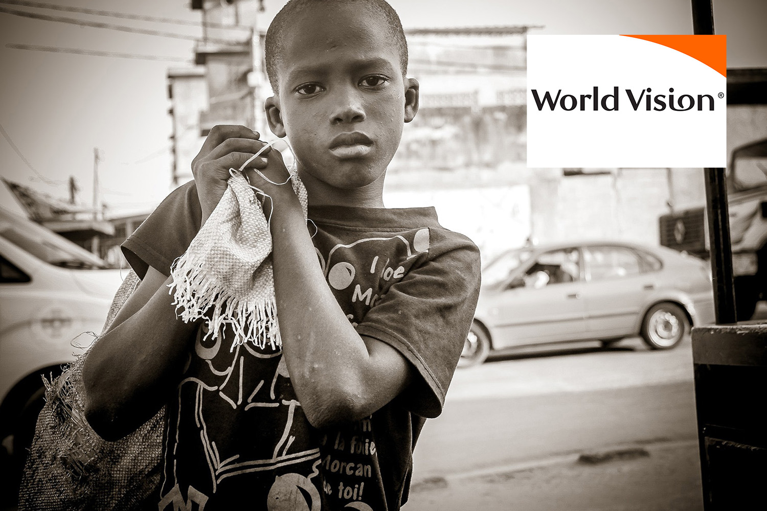 black and white photo of African child, with "World Vision" logo at the top right corner