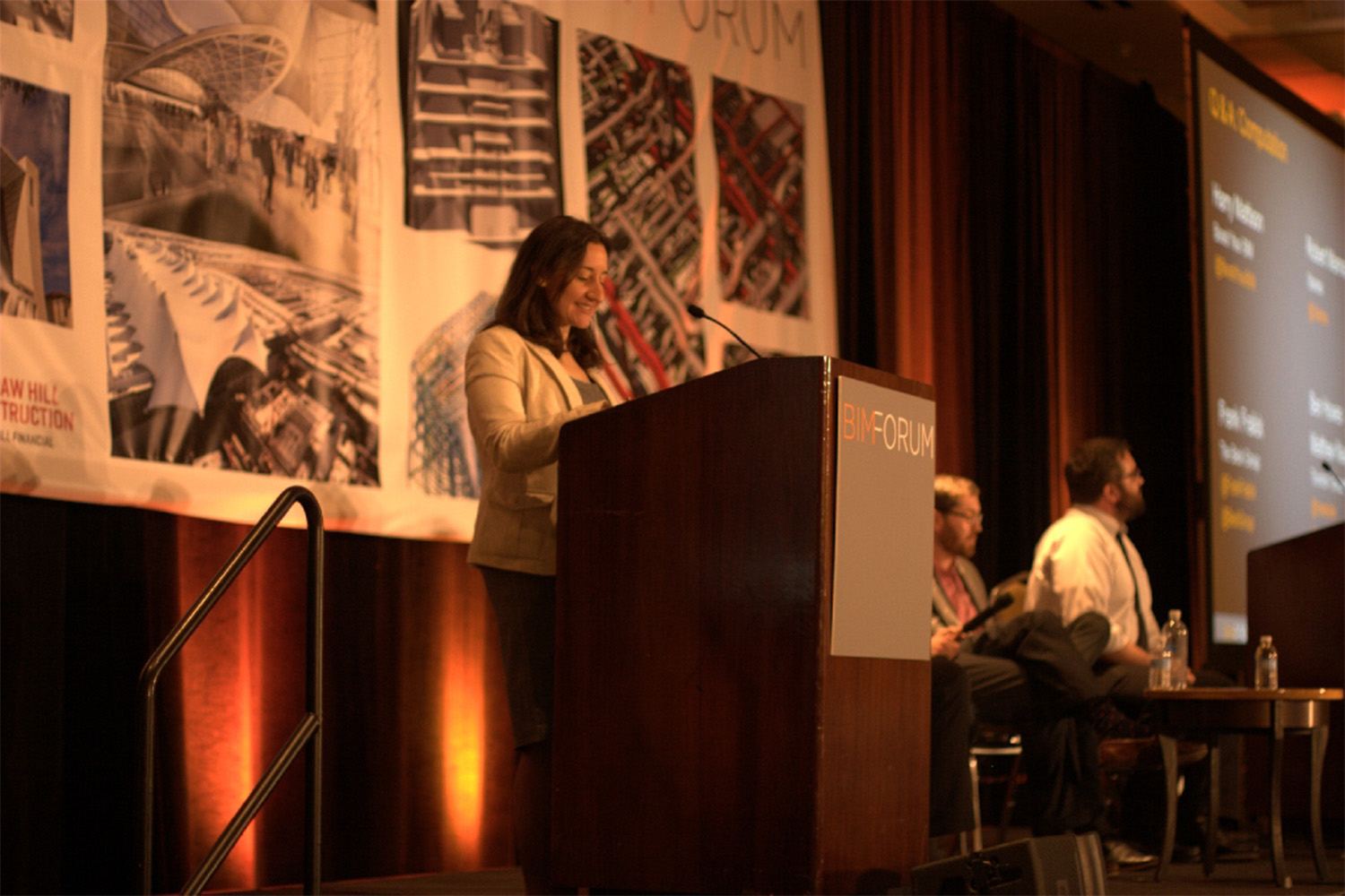 Laura Handler presenting behind a podium at the 2014 BIMForum 