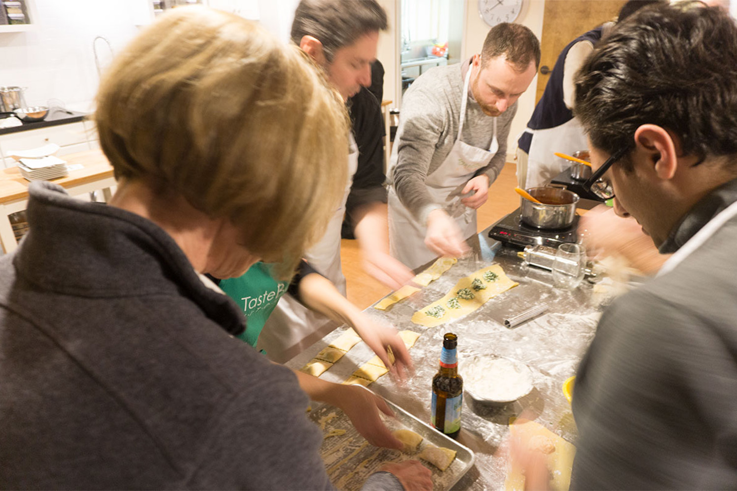 5 people filling ravioli 