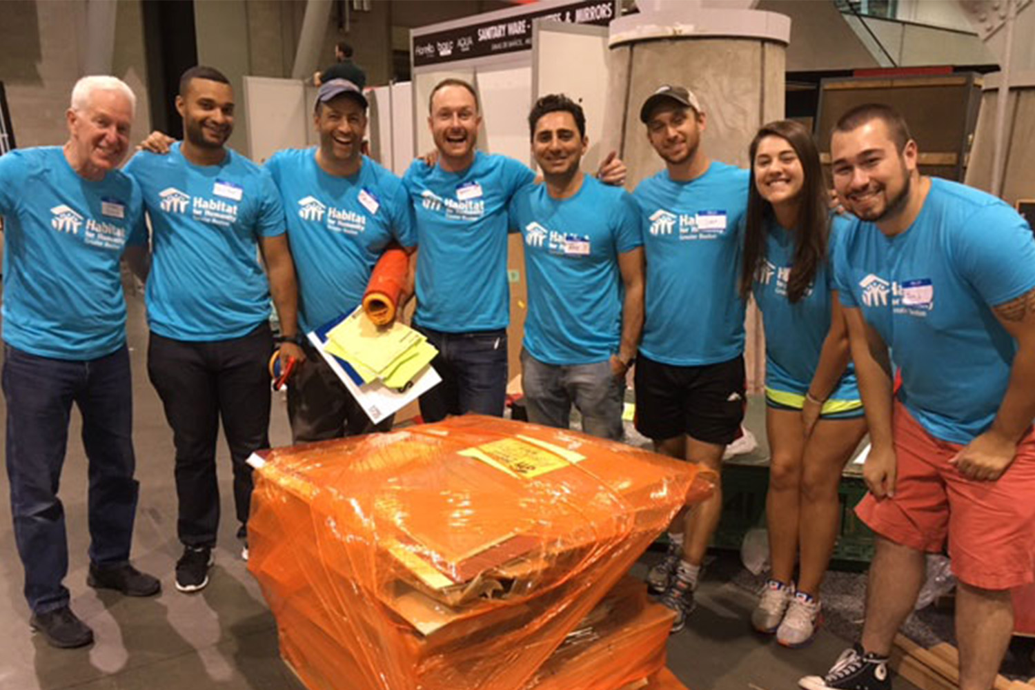 Habitat for Humanity volunteers at the Boston Orgill Event, posing in group photo 