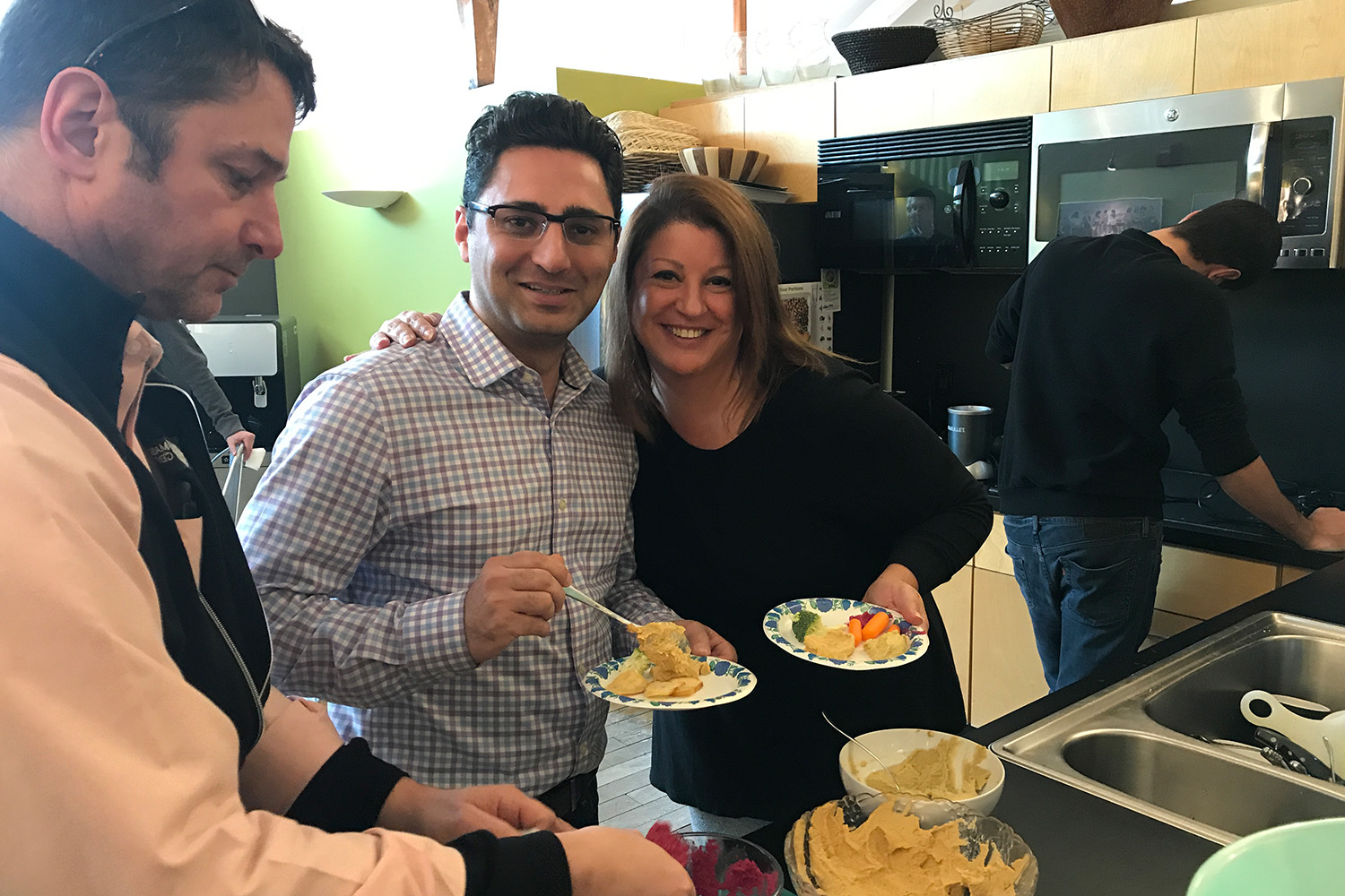 Staff sample hummus in the cafe