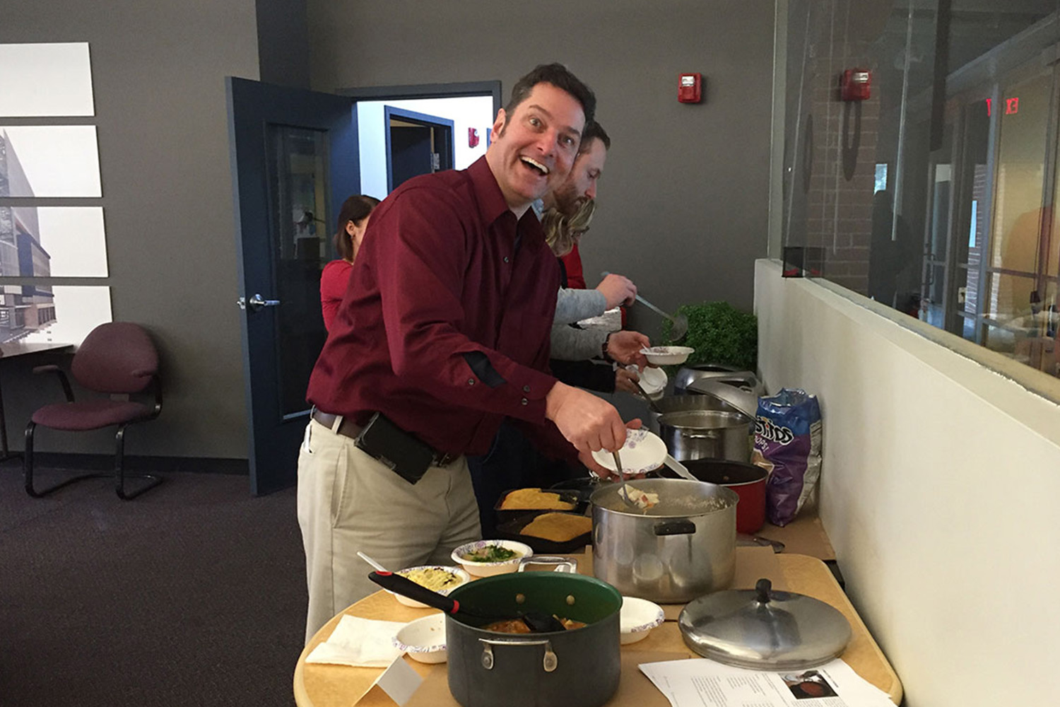 VJ Tocci ladles soup into a bowl during a soup tasting challenge held during the Super Bowl