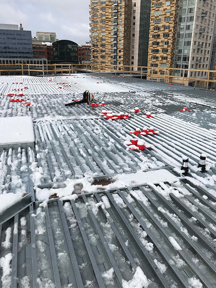 Steel beams covered in snow at Providence Hilton Homewood Suites