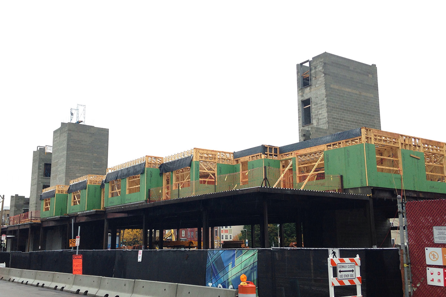 Streetview of Coppersmith Village, with wooden beams on top 