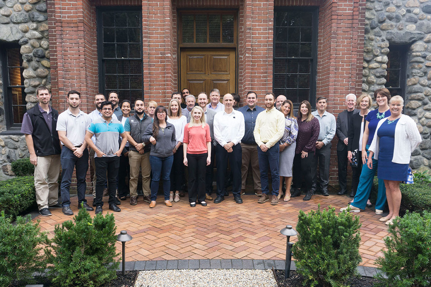 Tocci staff in front of 660 Main Street after receiving the 2018 WBA Best Business Award