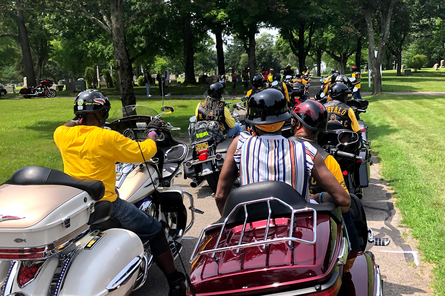 Members of the Buffalo Soldiers Motorcycle club on motorcycles, on the road