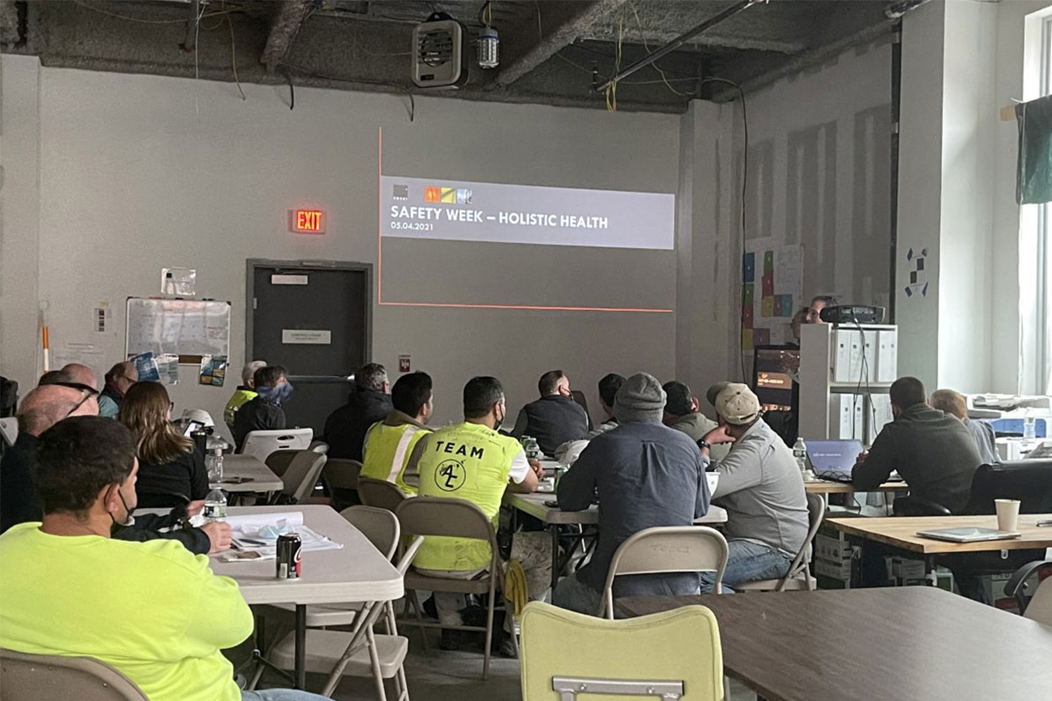 Bill Welch and Jim Boucher present on holistic health during National Safety Week to the project team and group of subcontractors on the Kendall East construction site in Cambridge