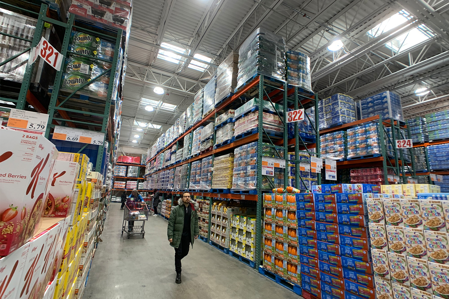 Man walks through aisle at Costco Warehouse in Waltham
