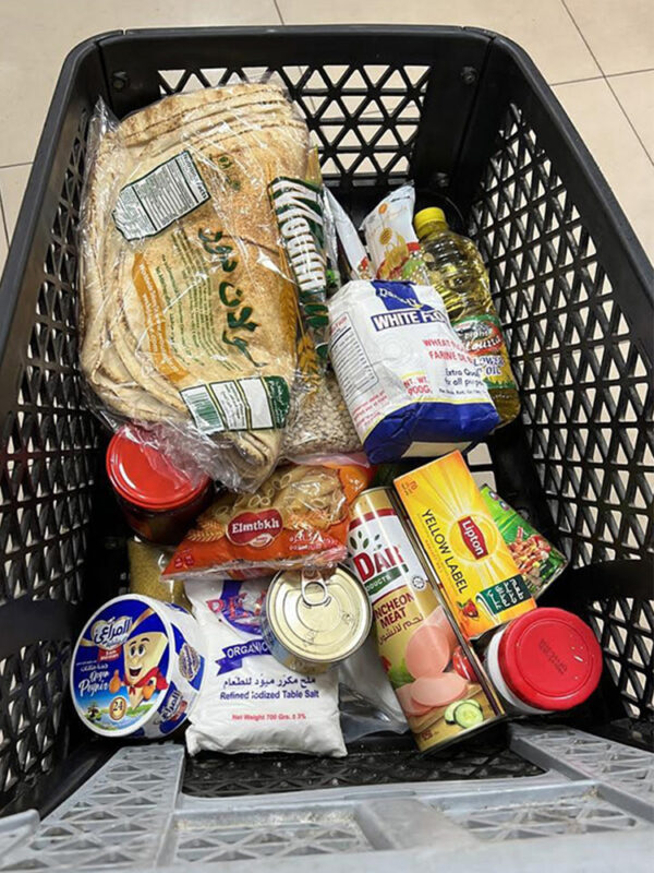 Grocery cart full of non-perishable food items to give to Lebanese people in need