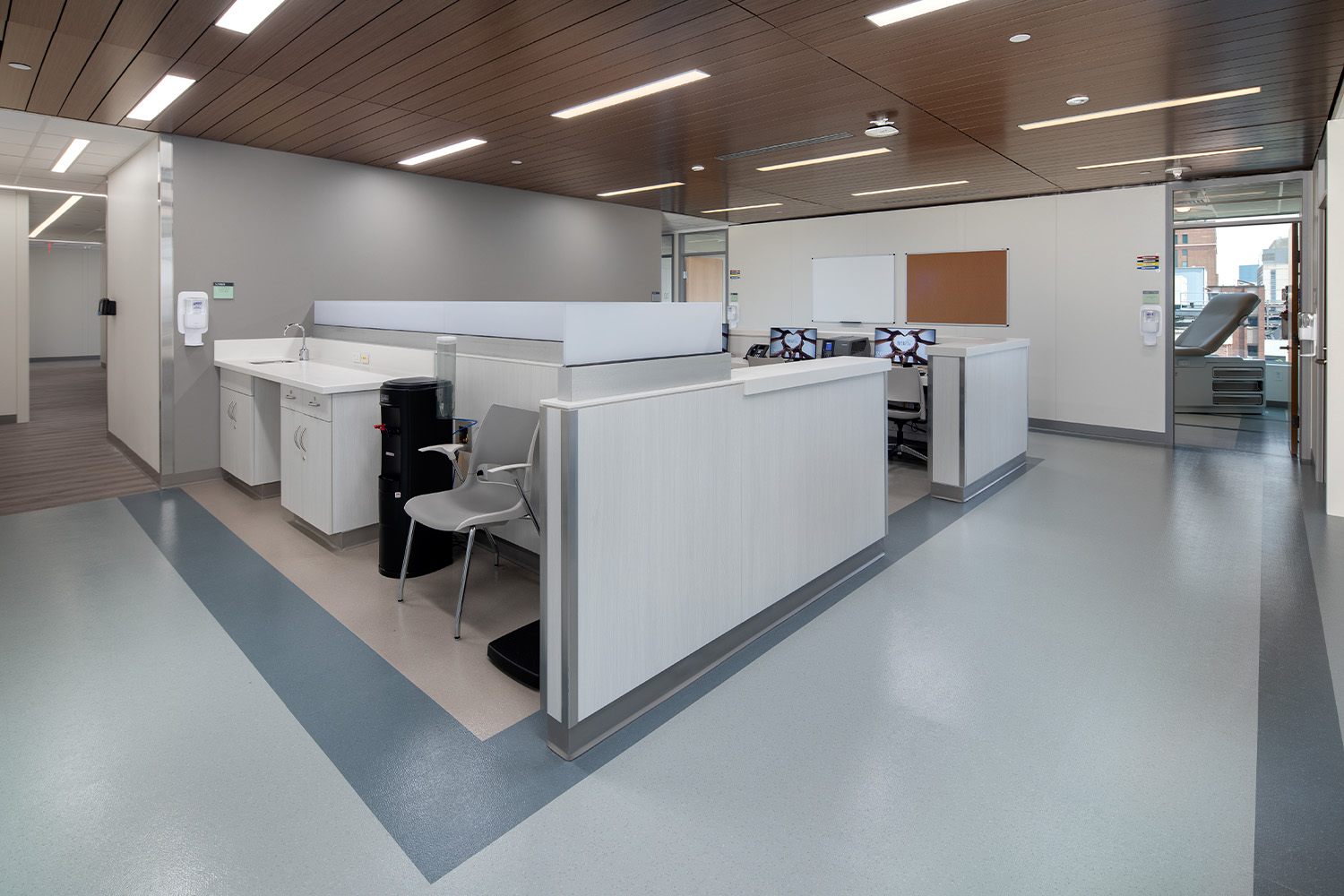 Nurse station under wood-paneled ceiling