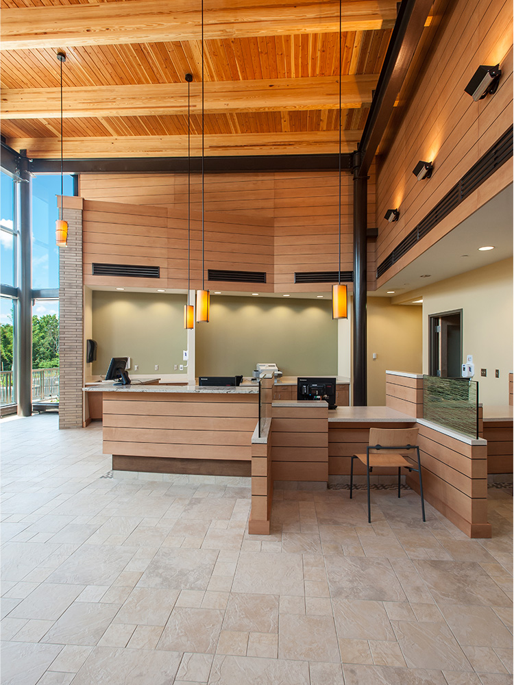 Lobby area with ample windows and elegant lighting 