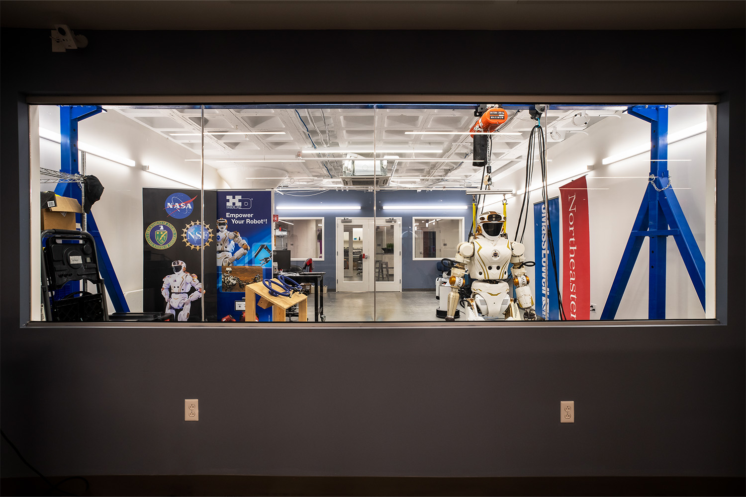 View of robotics lab as seen through window 