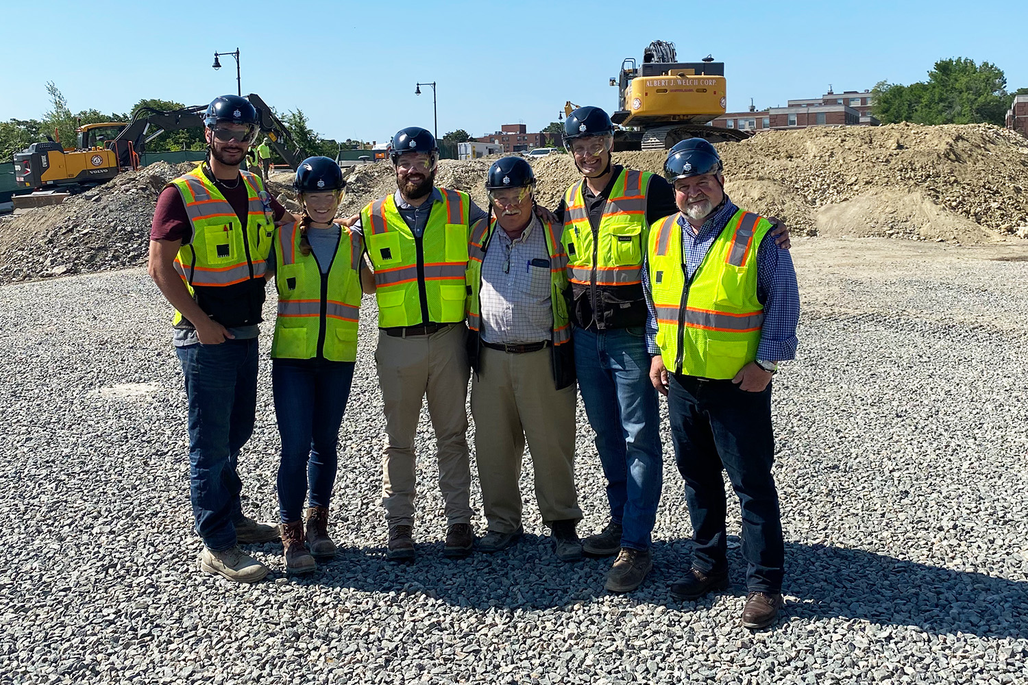 The project team wearing safety helmets