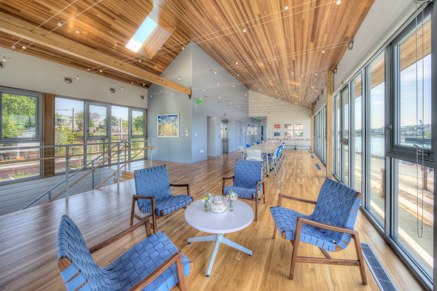 Lobby with stylish wood panel ceiling, same as wooden floor