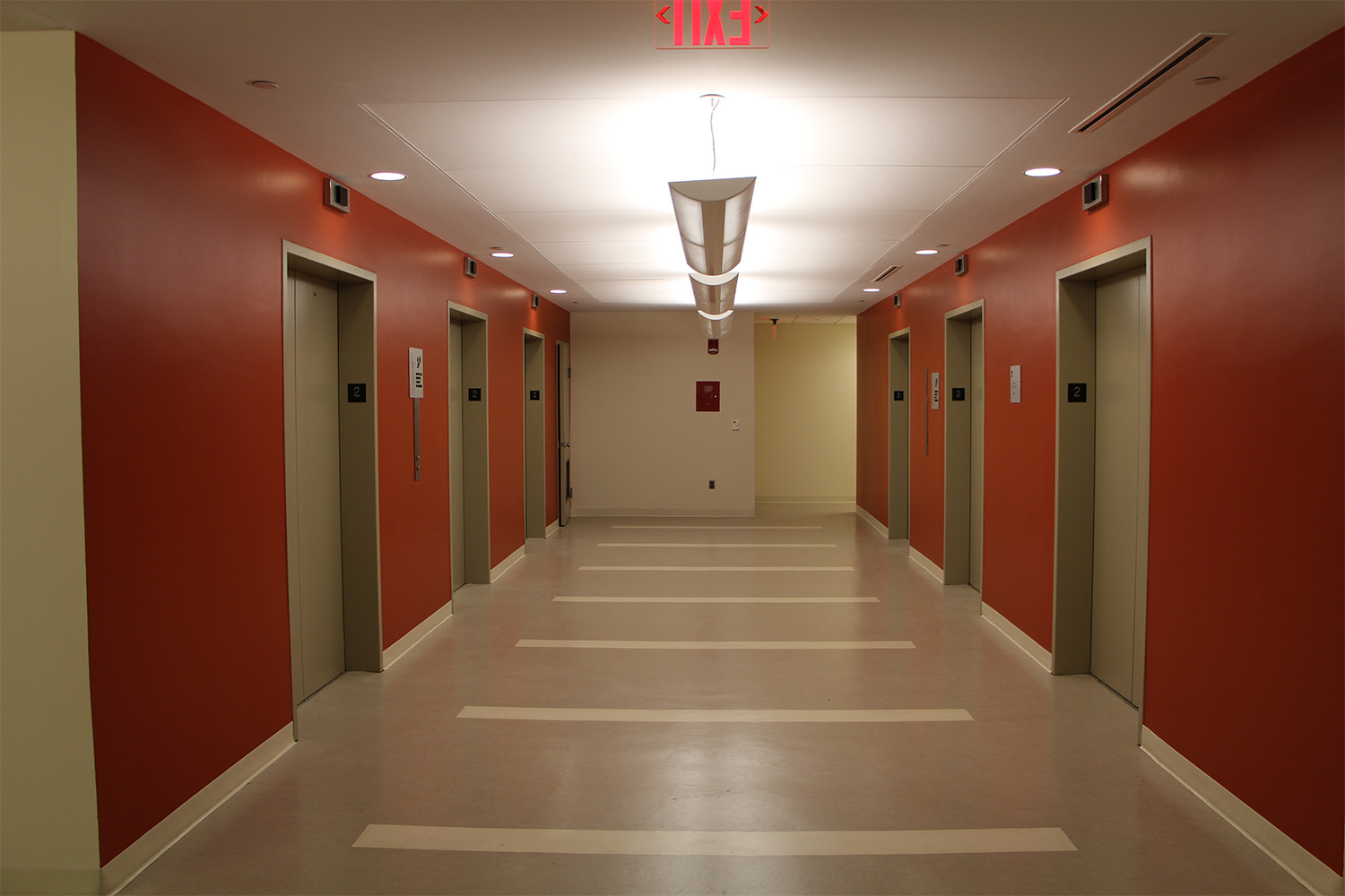 Hallway with crimson painted walls