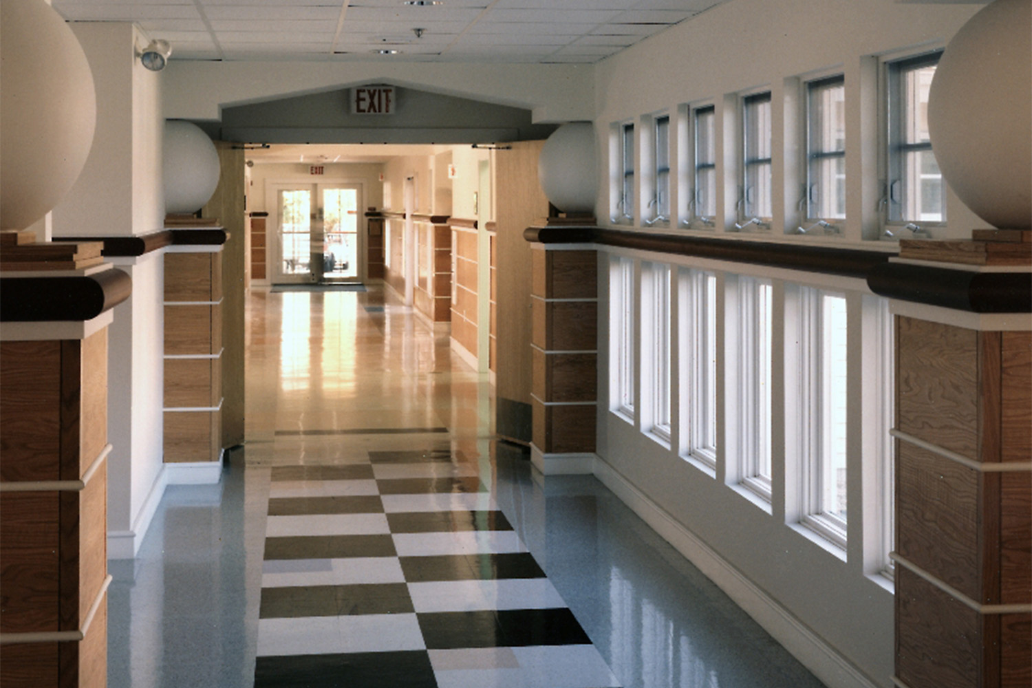 Long view of hallway with checkerboard tiling 