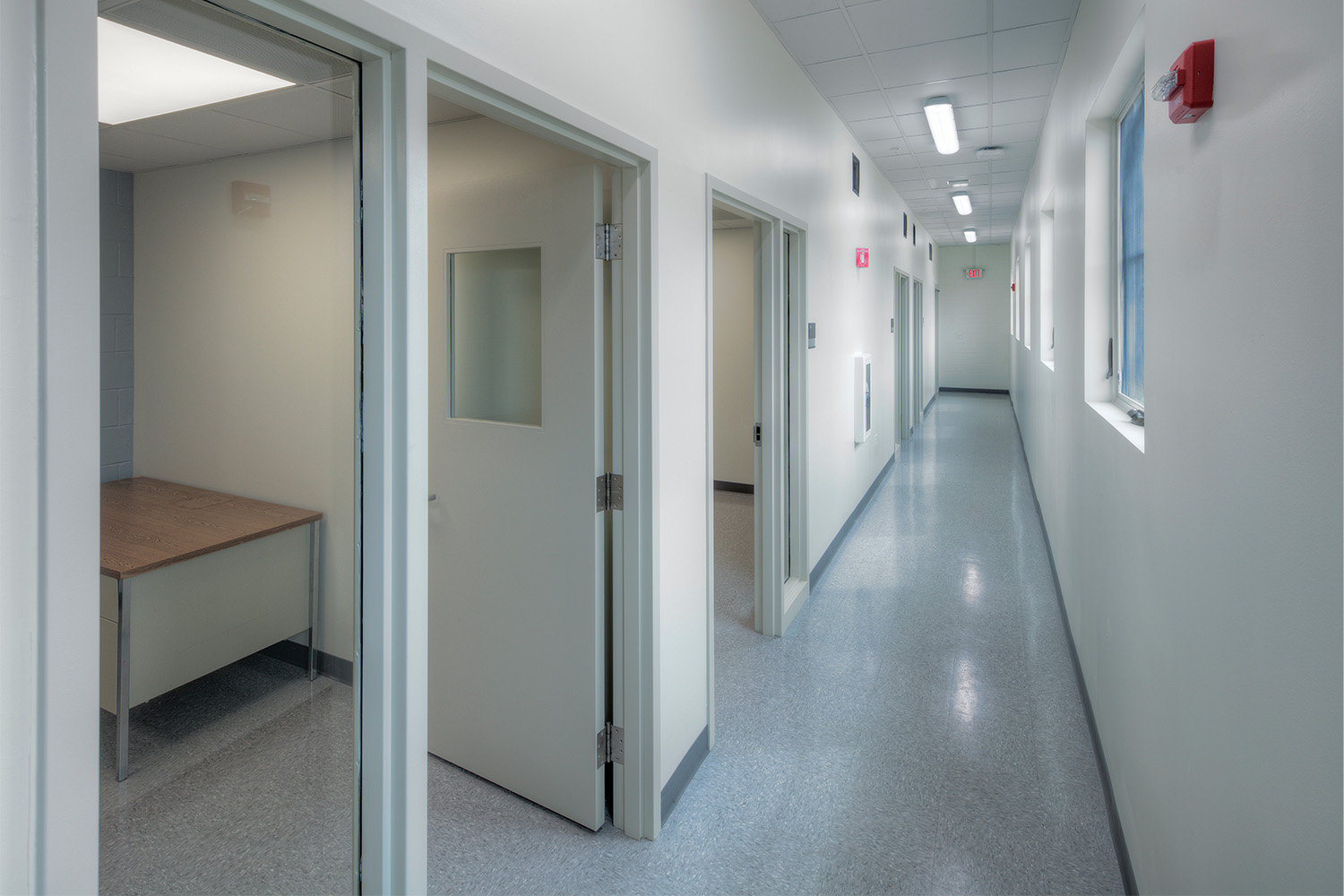 Empty hallway with windows on the right side