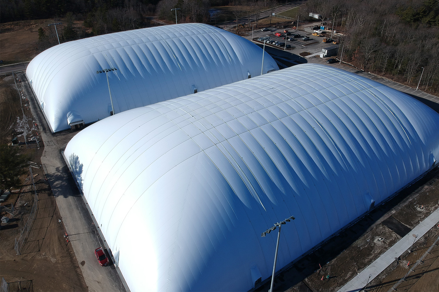 2 soccer fields covered with white bubble domes 
