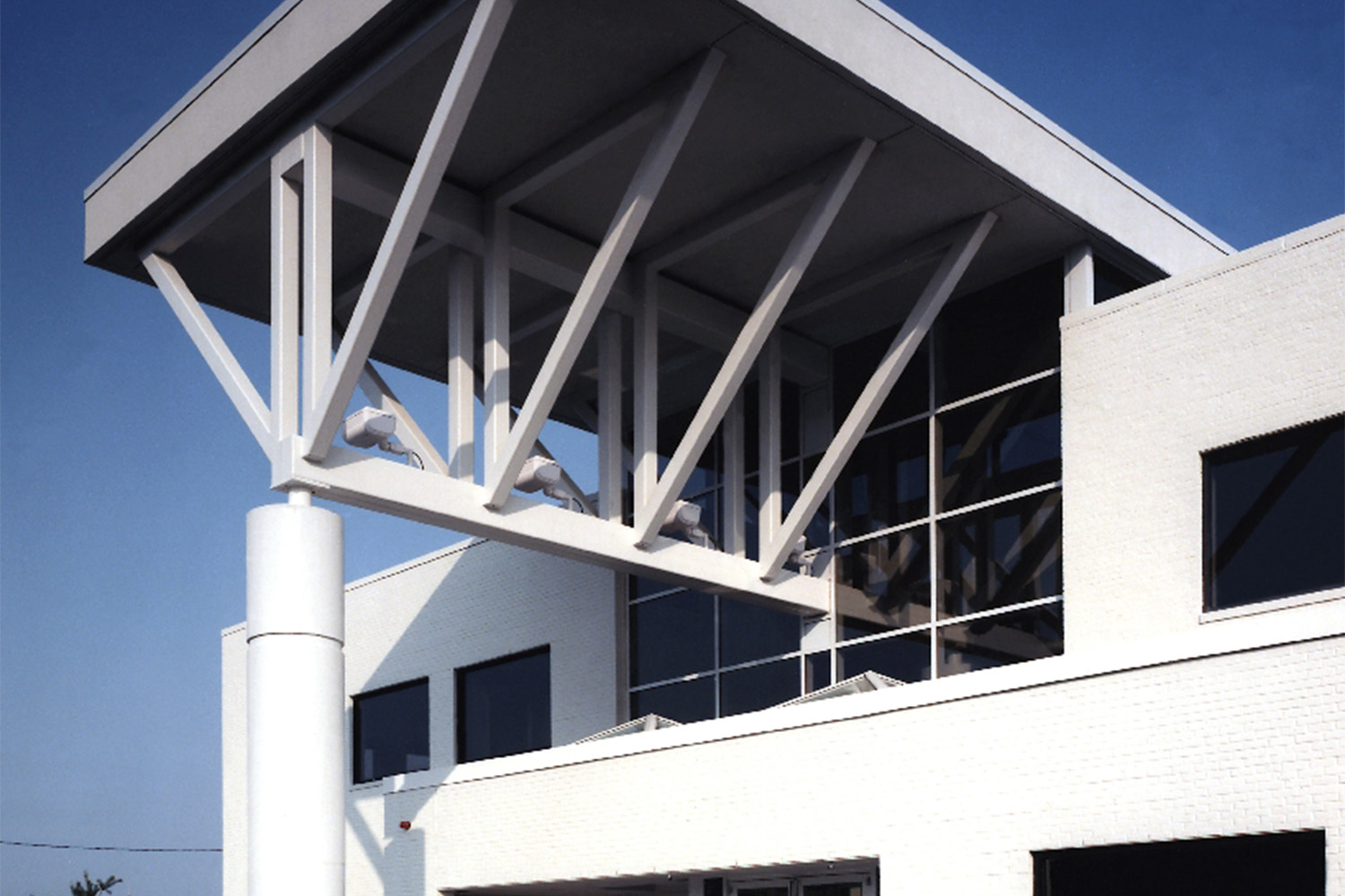 White metal beam entry detail seen at exterior 