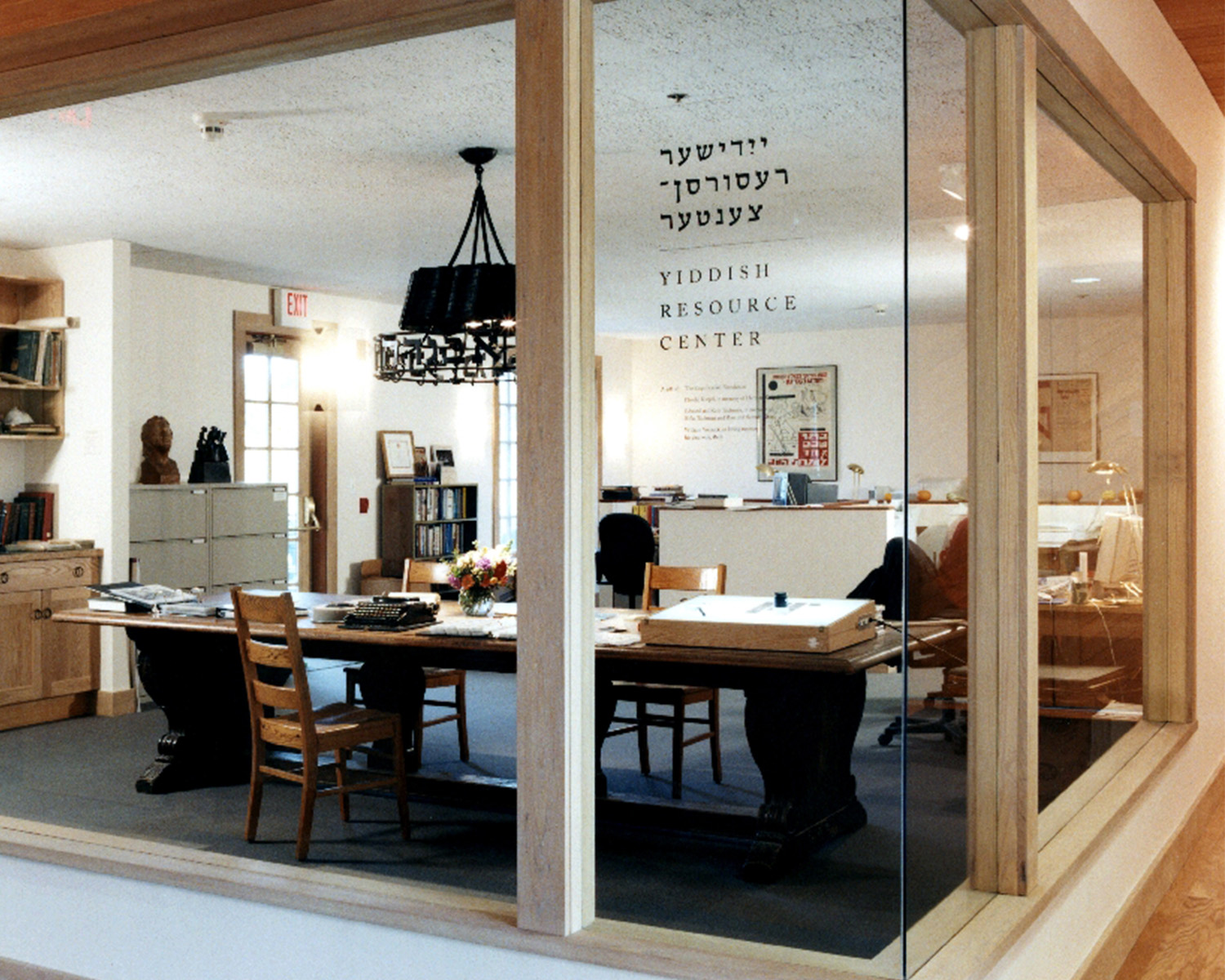 Resource Office complete with chairs and tables, as seen through a window