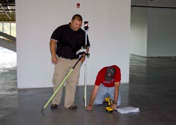 2 men working on building layout