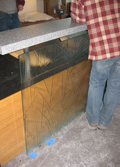 man standing in front of glass panel