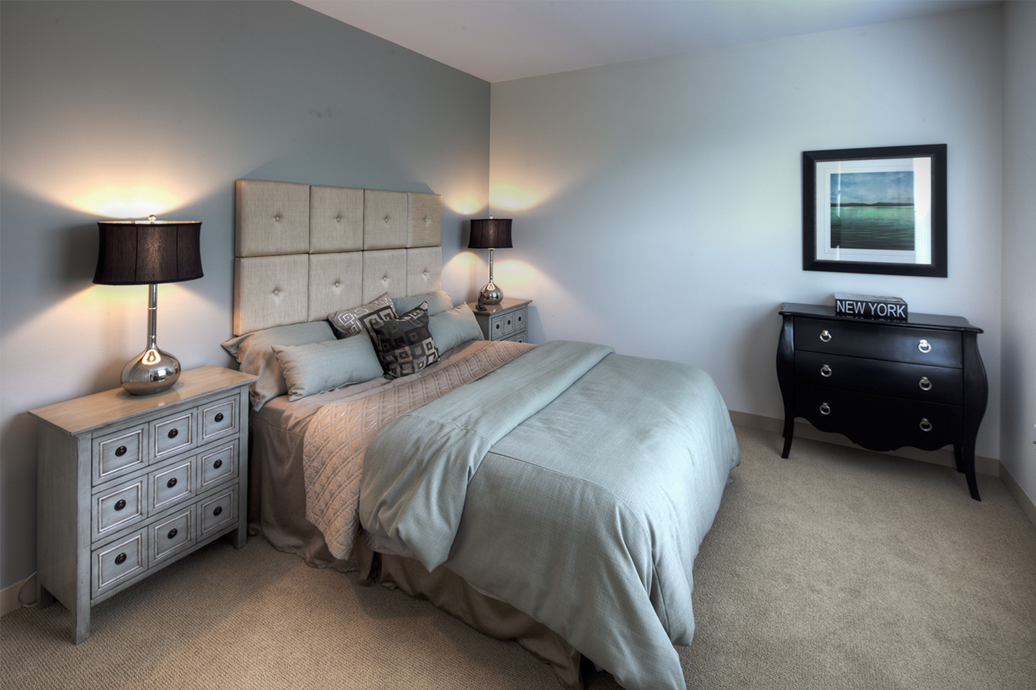 Grey bedroom with bedside table 