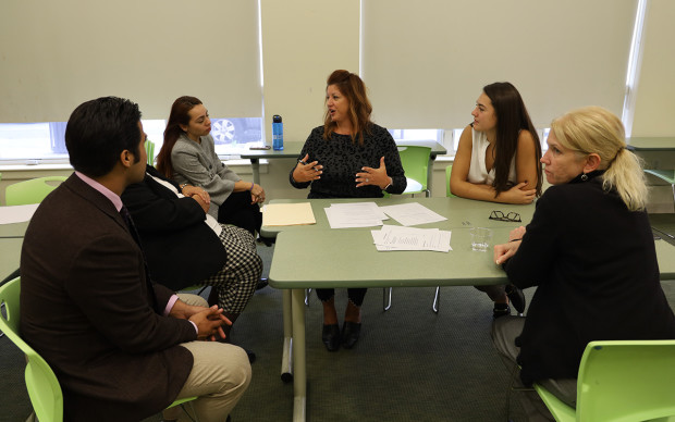 6 people talking at mock interview 