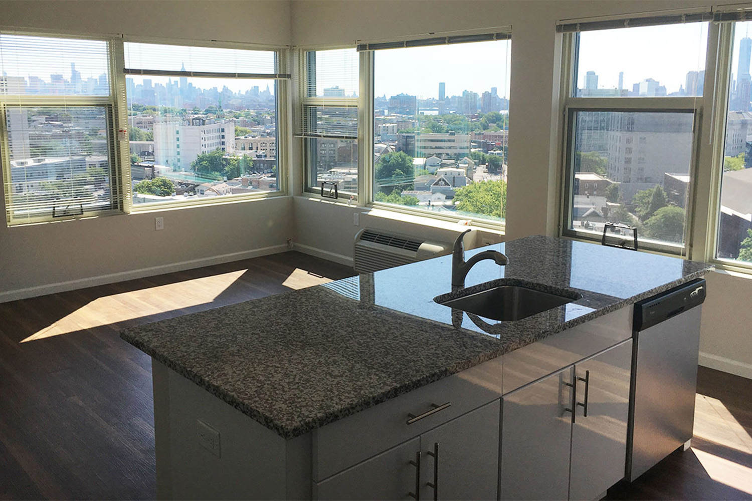 Kitchen with window view of cityscape