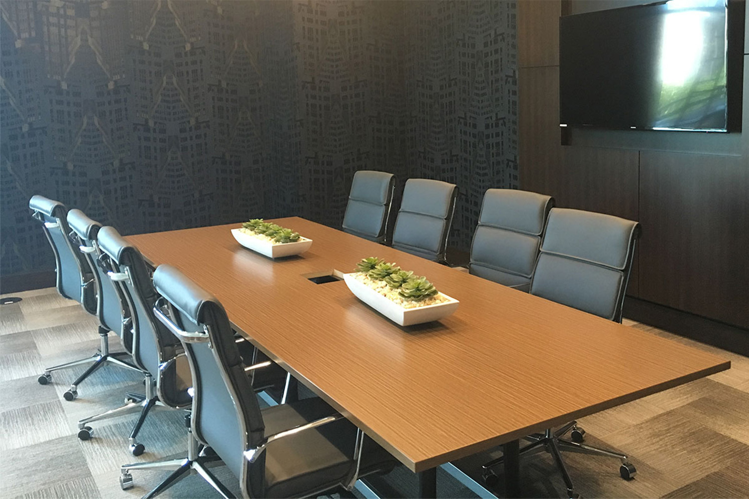 Empty conference room with carpet checkerboard flooring, and black walls