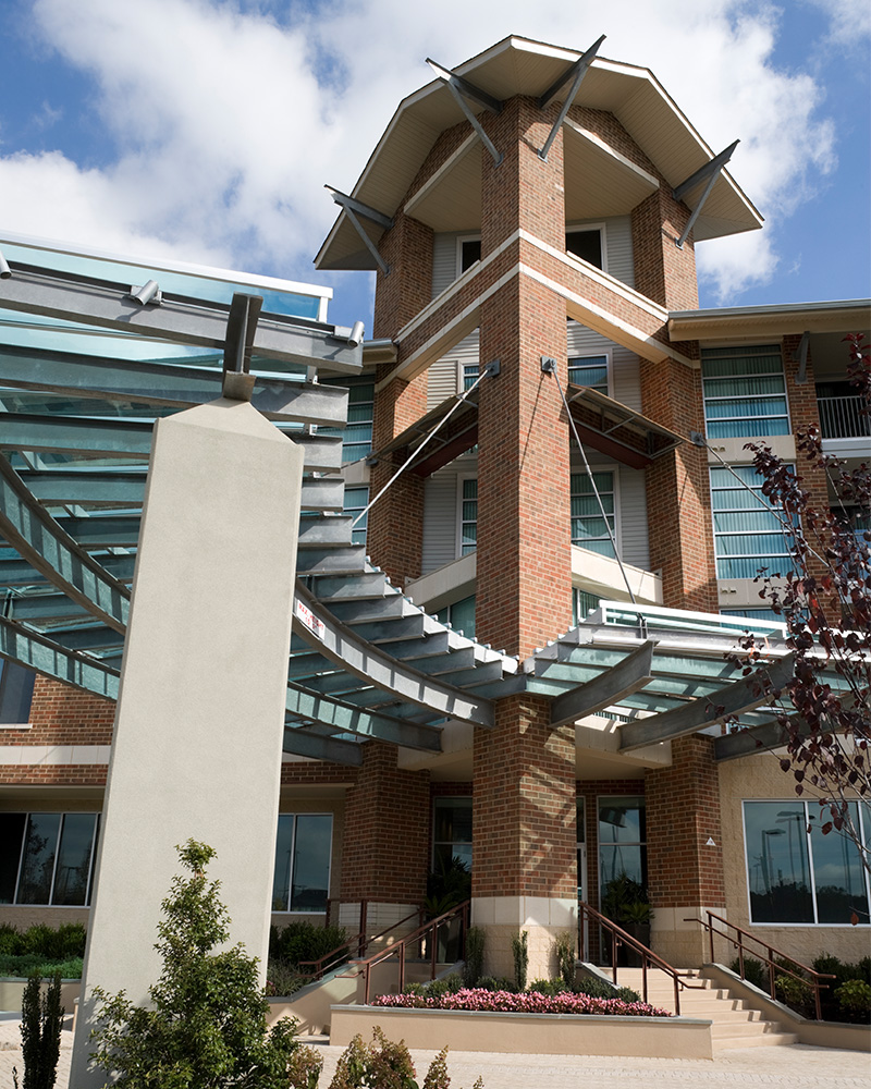 Tall structure attached to building during daytime