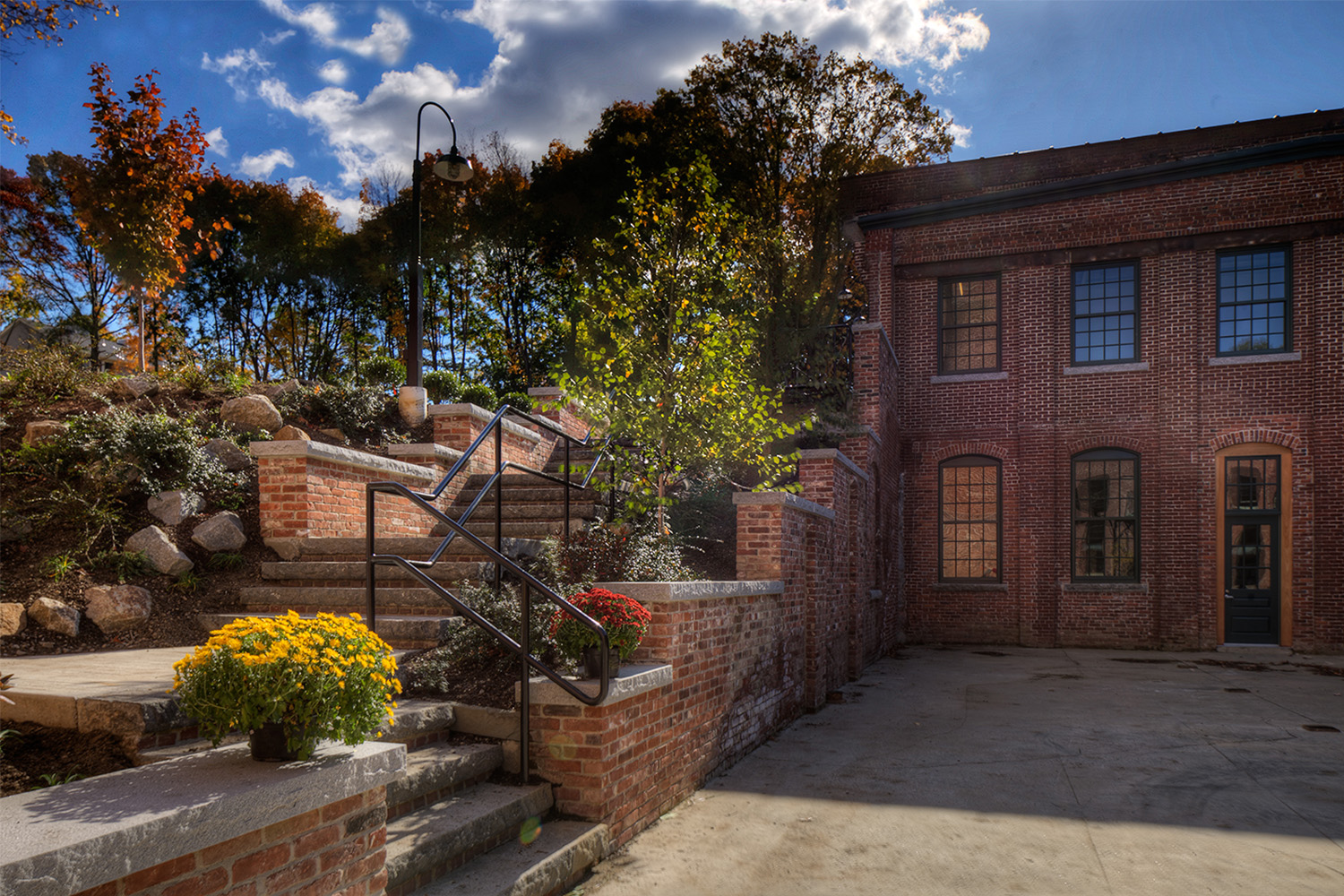 Red brick steps with planters 