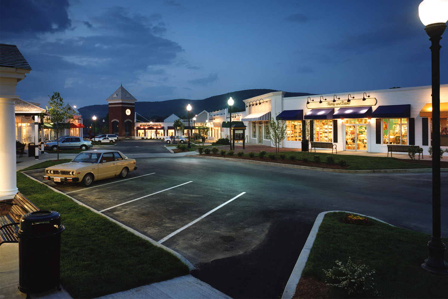 Nighttime view of Berkshire shopping outlet, seen from across parking lot 