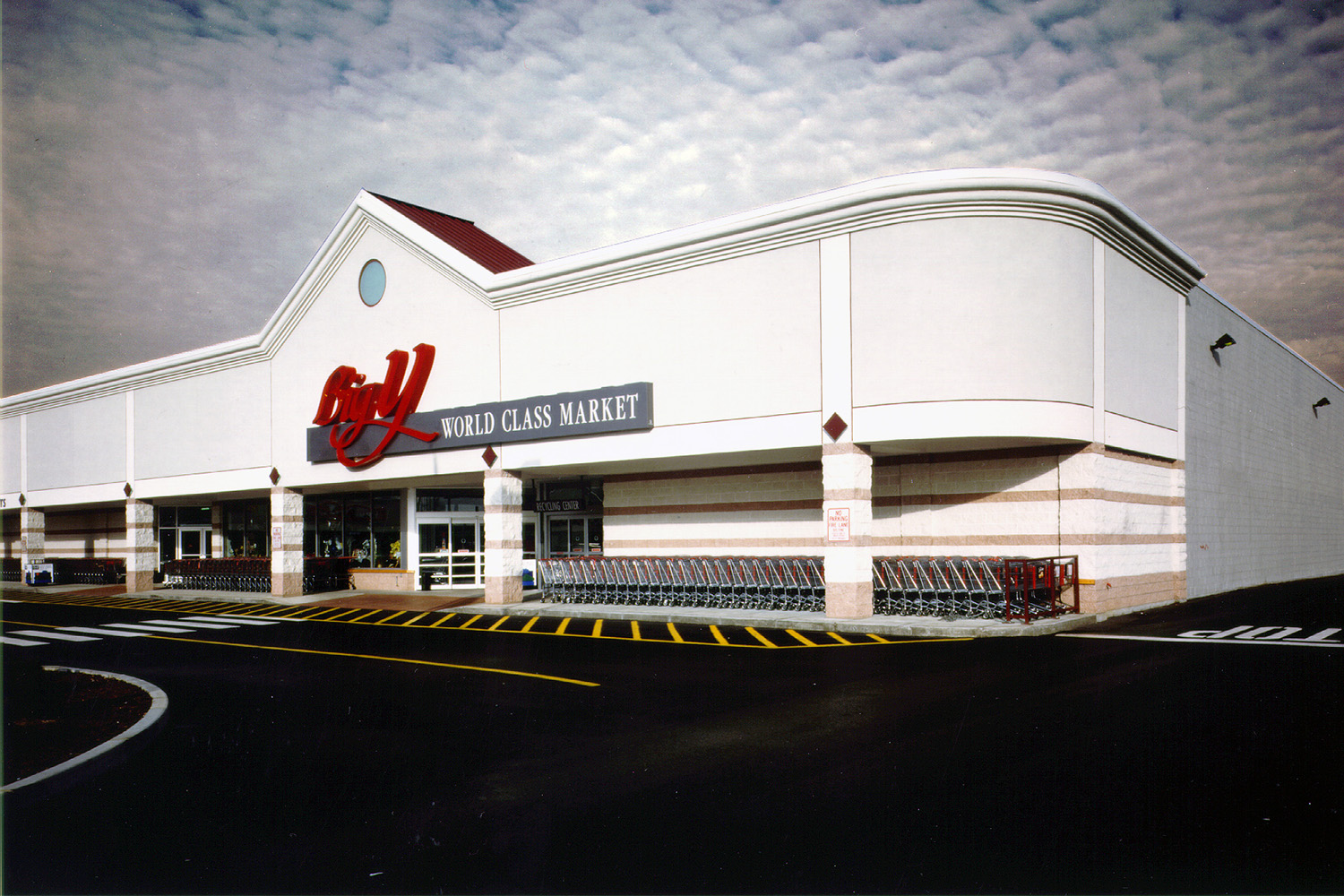 Exterior of "Big Y" grocery store seen on a cloudy day 