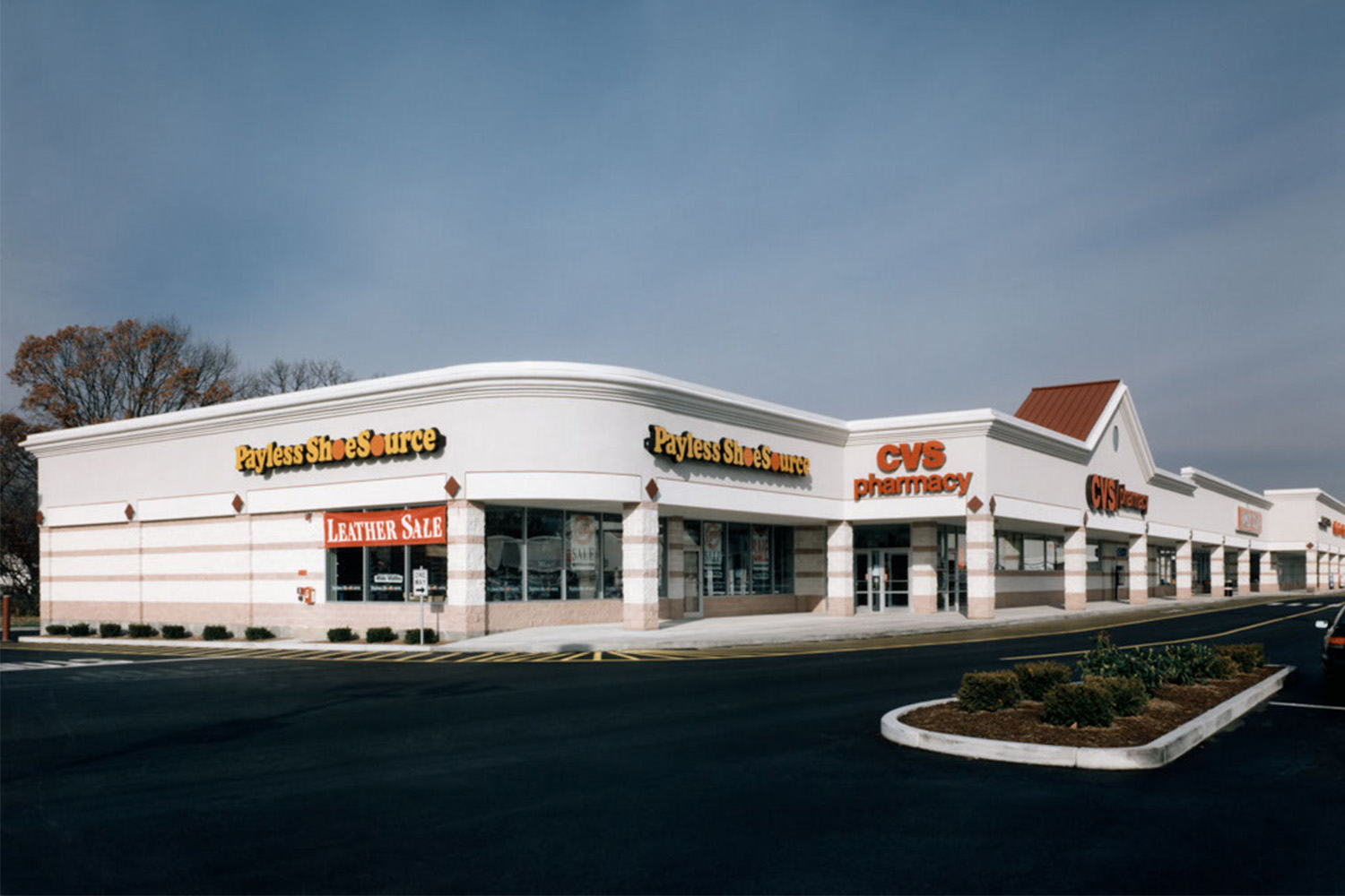 Distant view of "Payless" shoe store and "CVS" pharmacy
