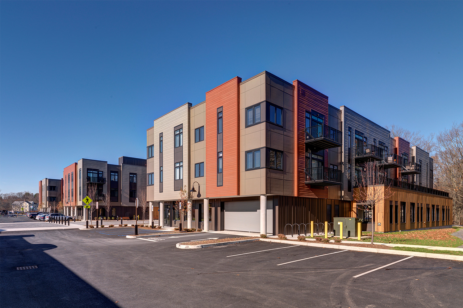 Front facade of Brookside Square, with parking lot in front 