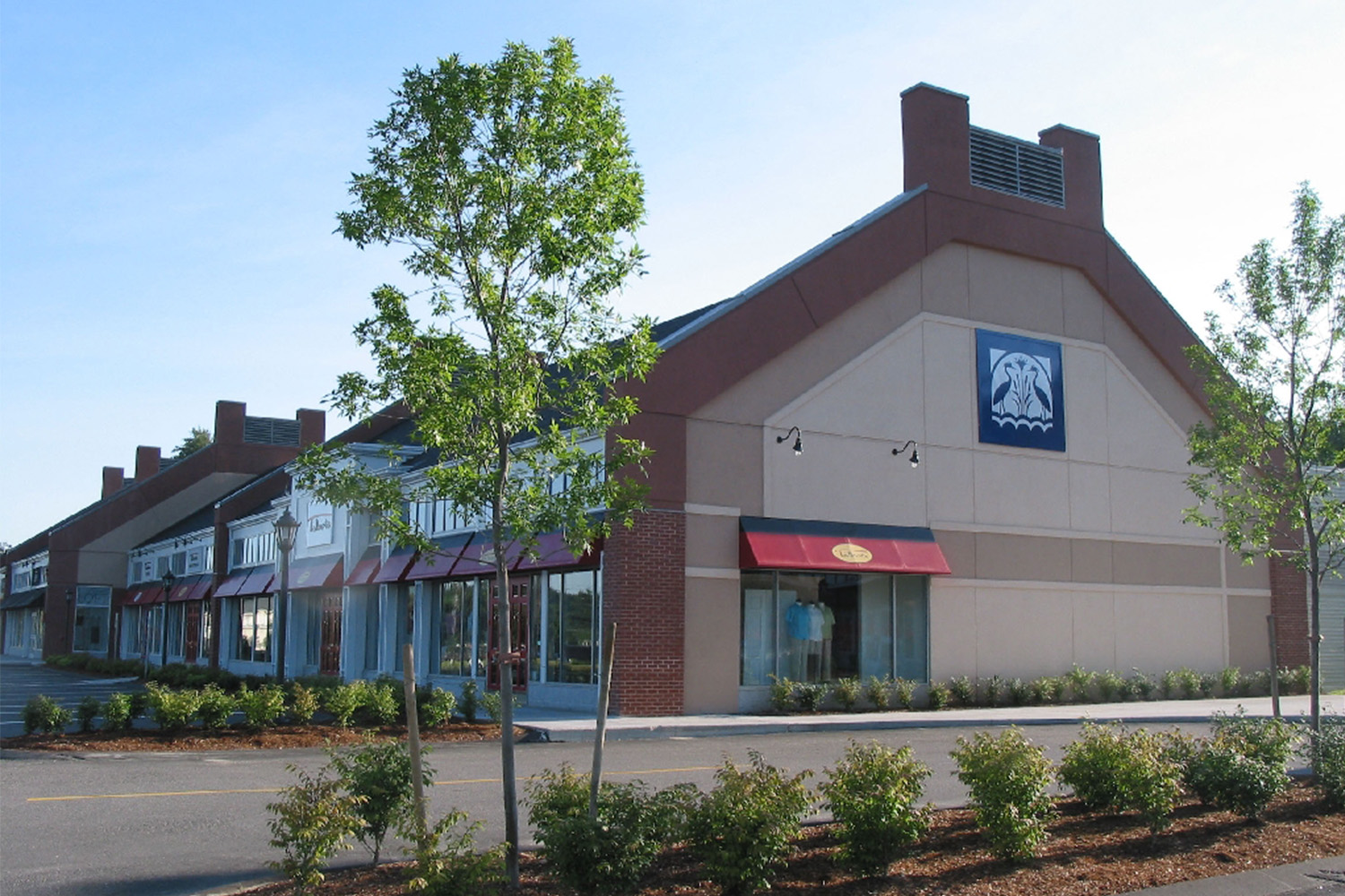 Side exterior of mall outlet, made of tan concrete bricks 