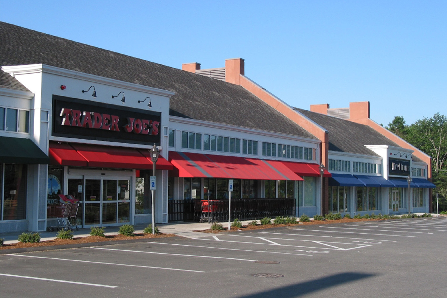 Longview of "Trader Joe's" storefront, with parking lot in front of store 