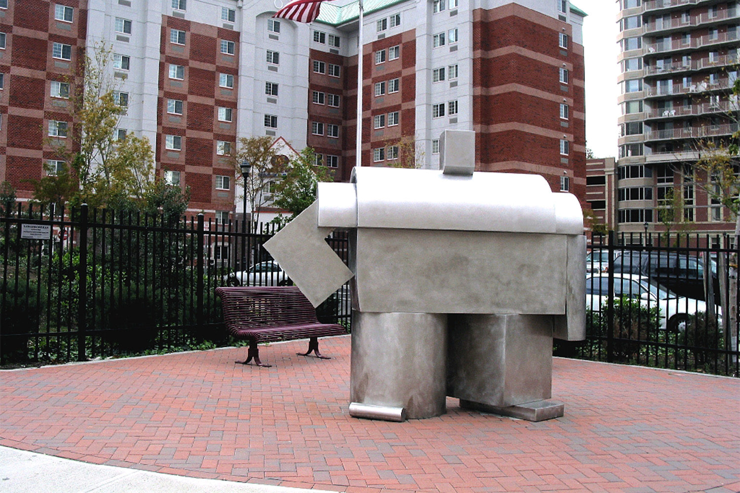 Modern-art sculpture made out of sheet metal, seen outside of hotel
