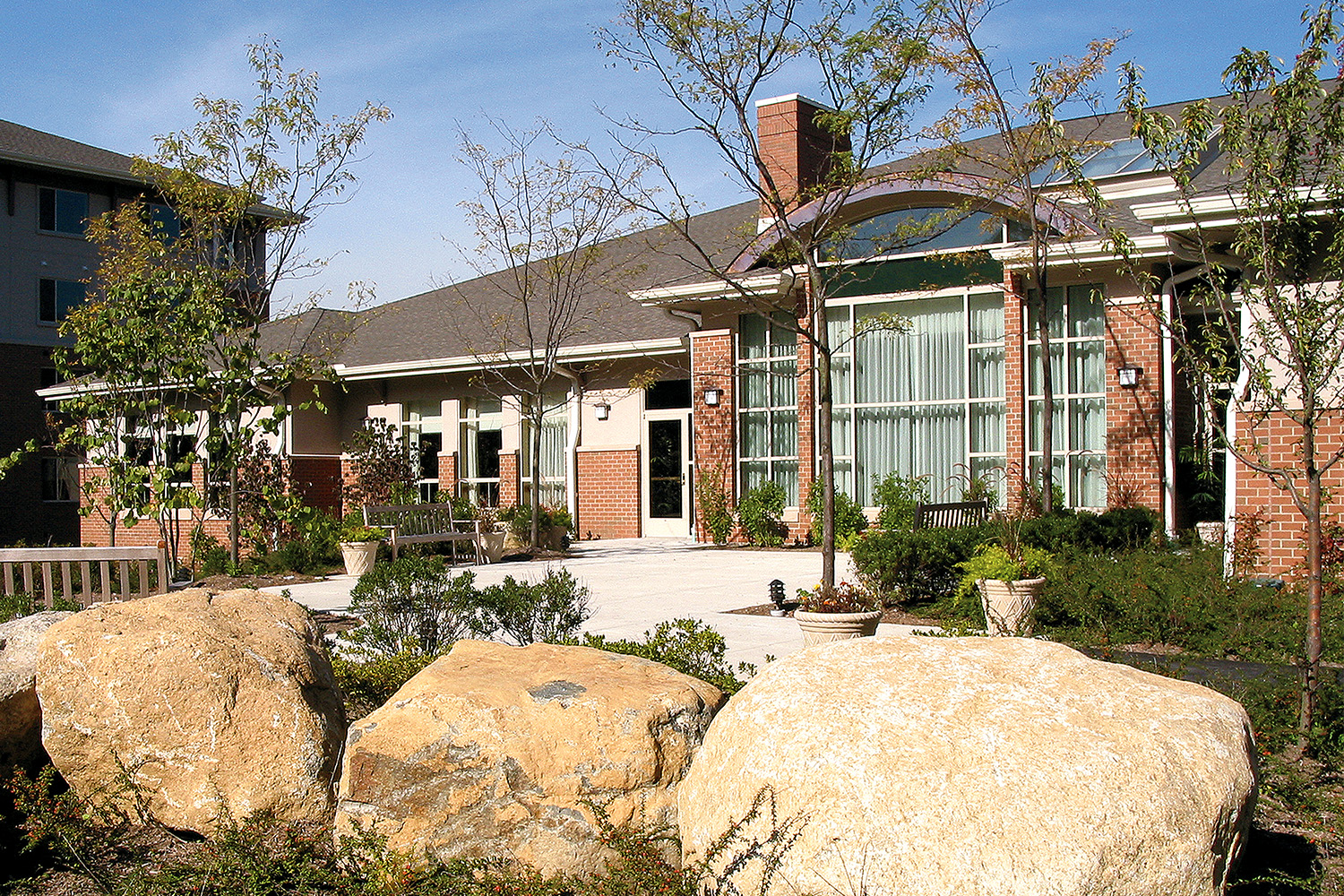 Exterior entrance seen from across 3 rock boulders  