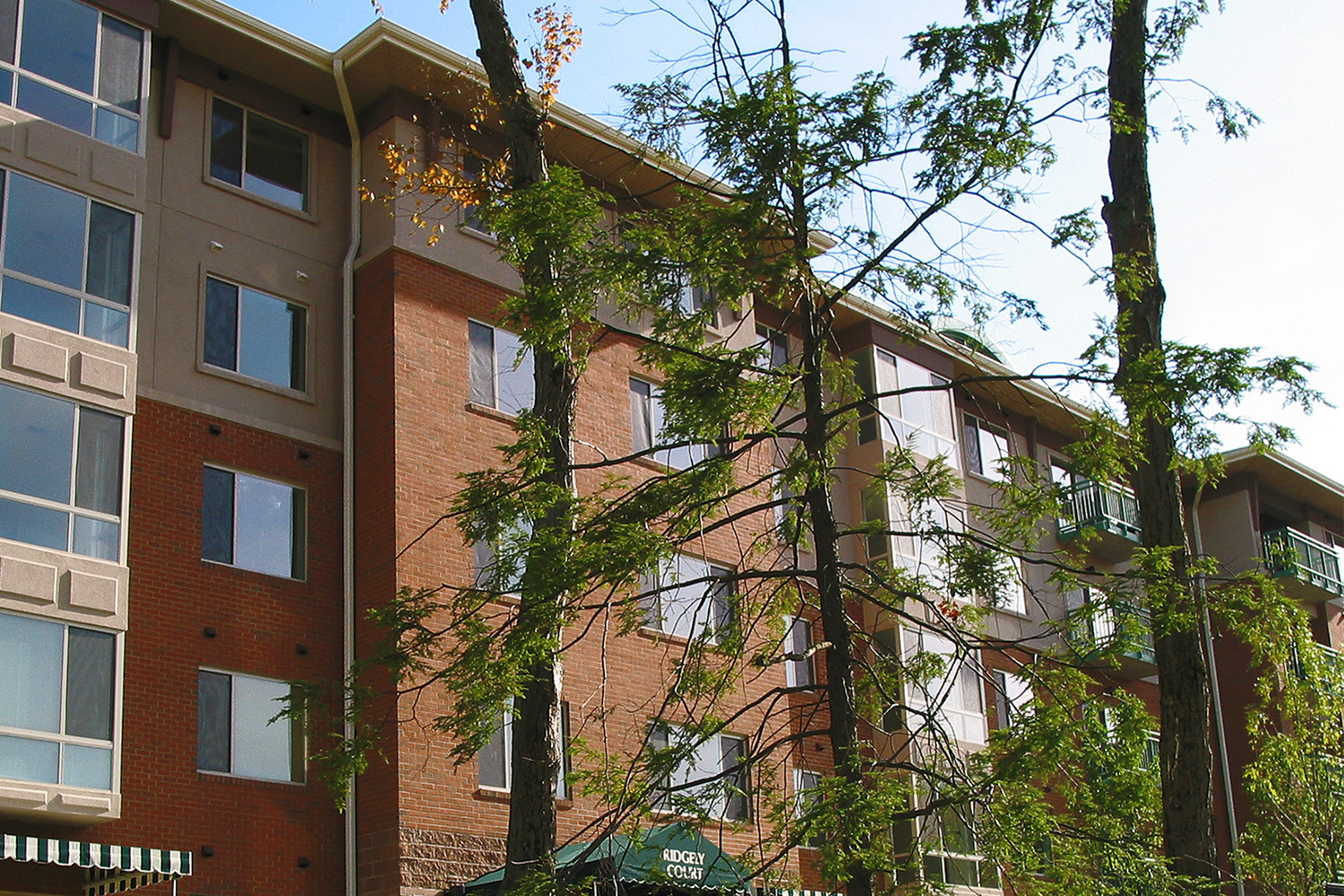 Façade of Cedar Crest housing complex, seen at a slant