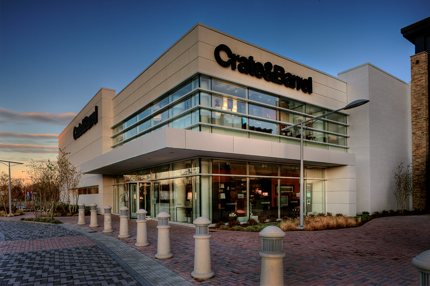 Exterior store entrance, seen at dusk