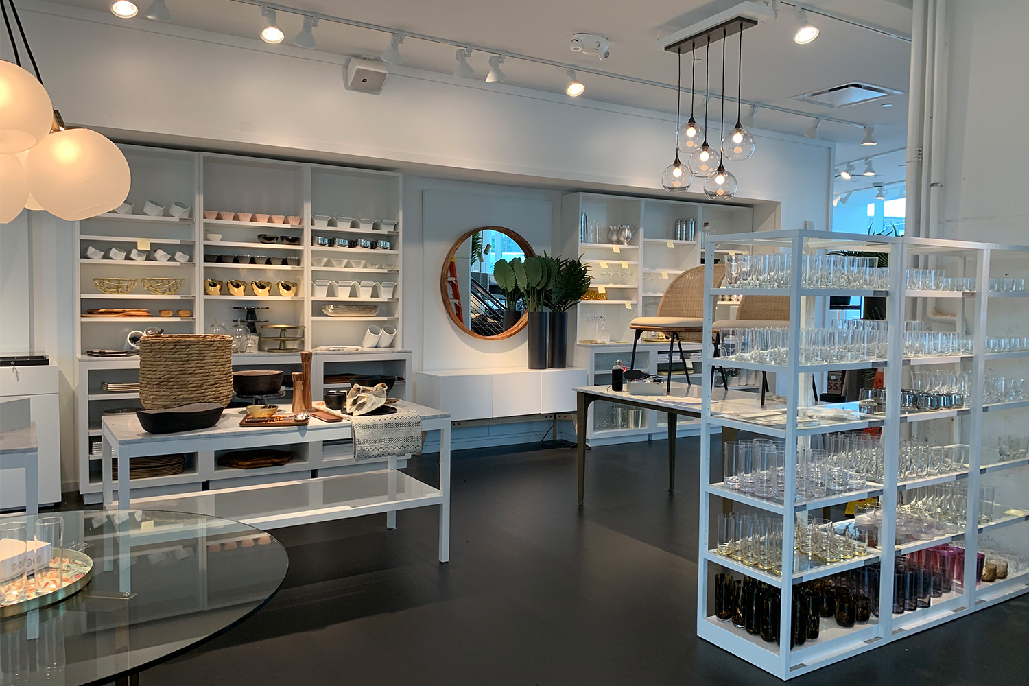Candles on shelves, along with various store merchandise