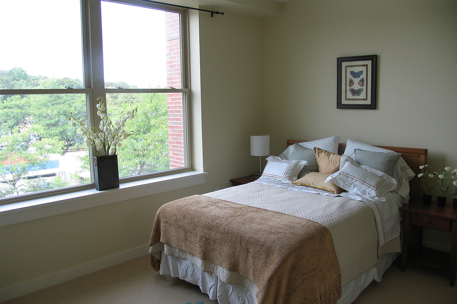 Quaint bedroom with wide window