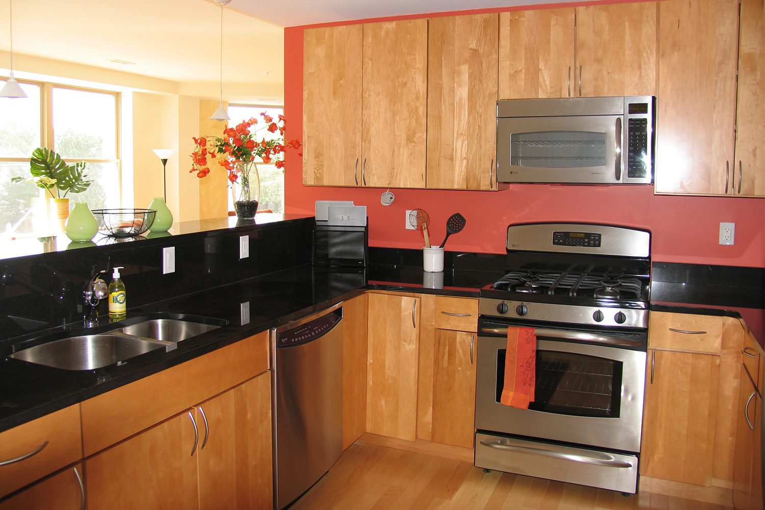 Kitchen with wooden cabinets and red walls 
