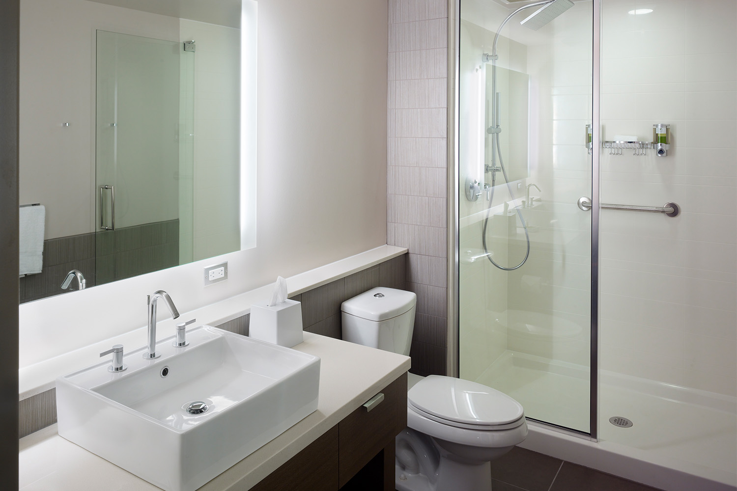 Simple bathroom with stand-in shower and amenities 