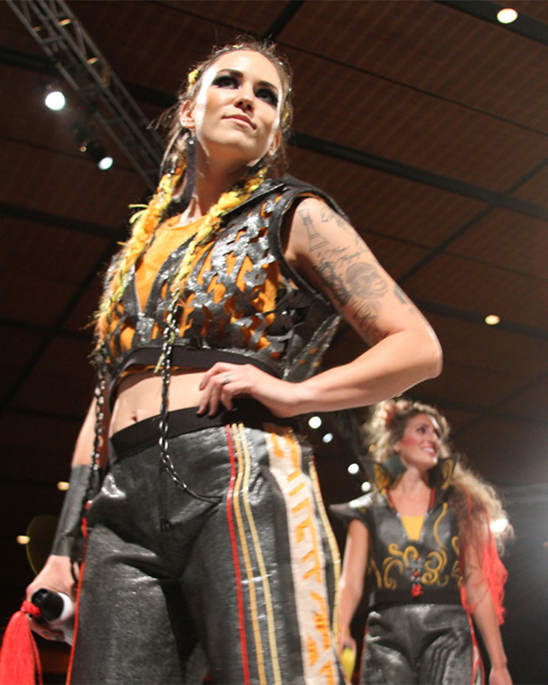 Model posing at end of runway 
