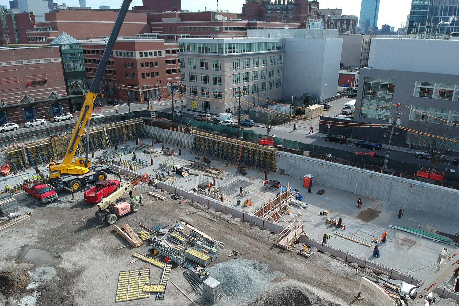 Drone view of construction overlooking the city 